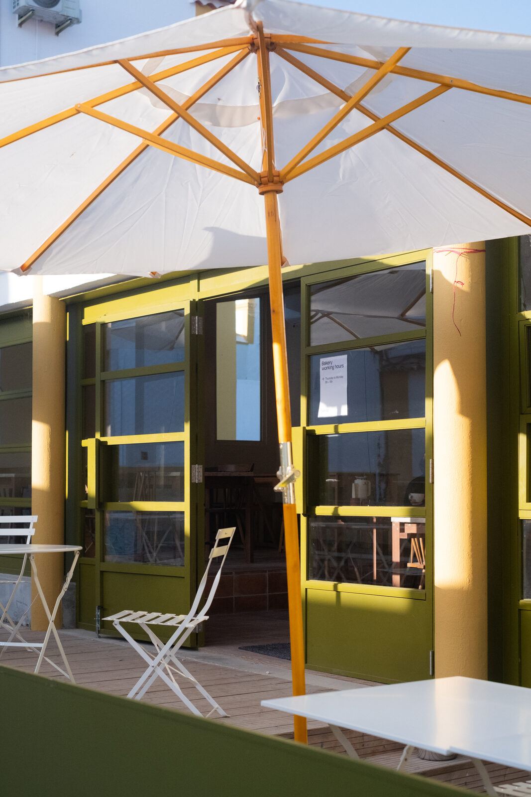 Terrace with umbrellas and window frames, DOMA