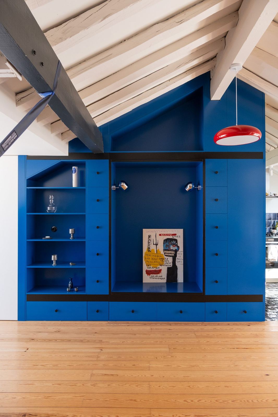 Blue Cabinet: deep blue built-in under a sloped roof