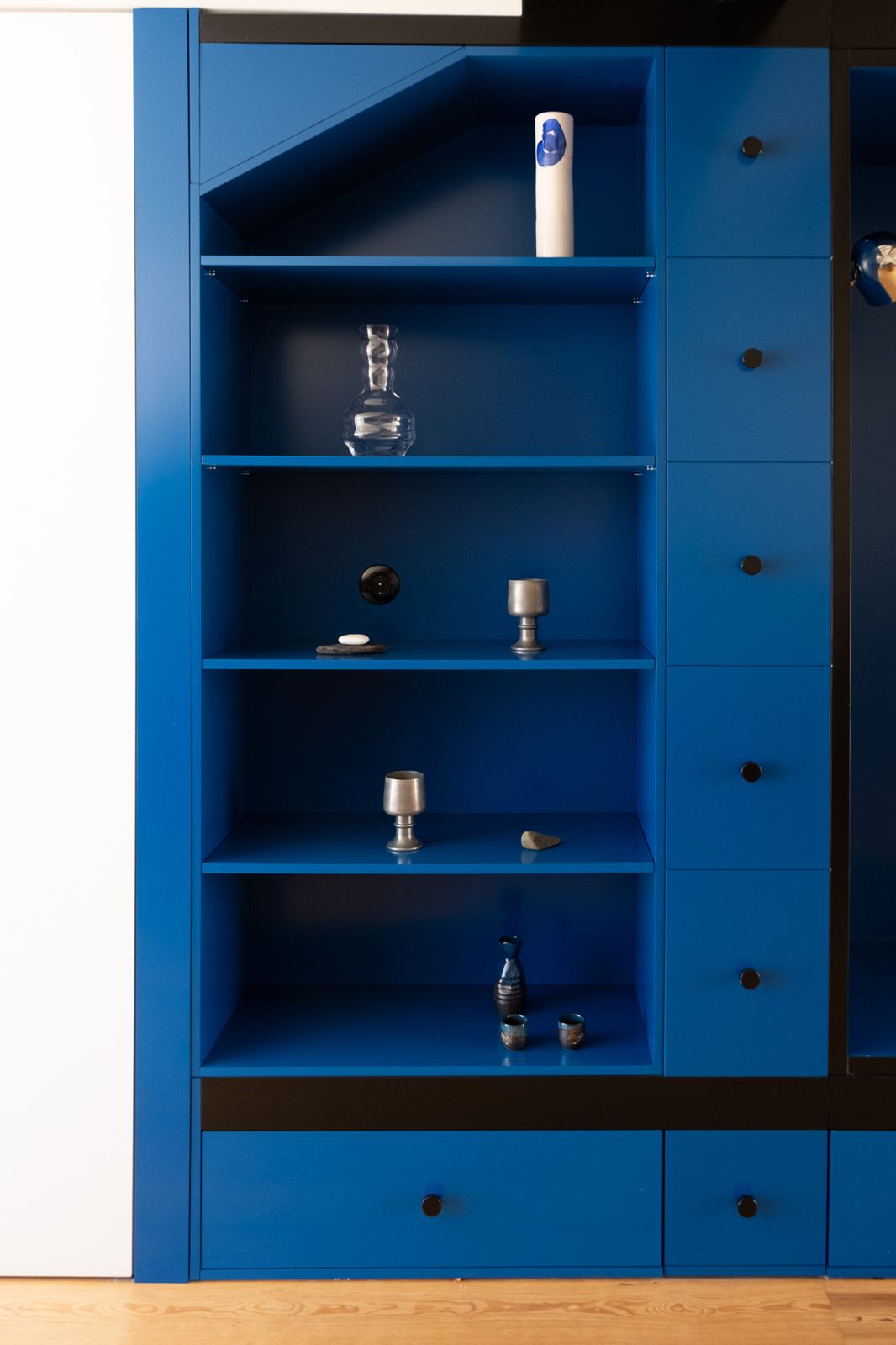 Blue shelving section with objects, Blue Cabinet
